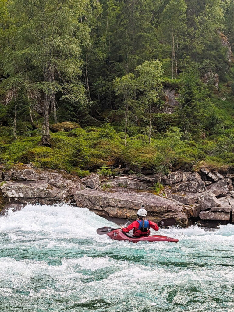 Whitewater kayaking on the Raundalselva river Playrun, Norway.