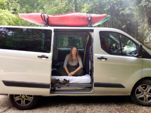 Kayak life. Living van life trip with kayaks on the roof.