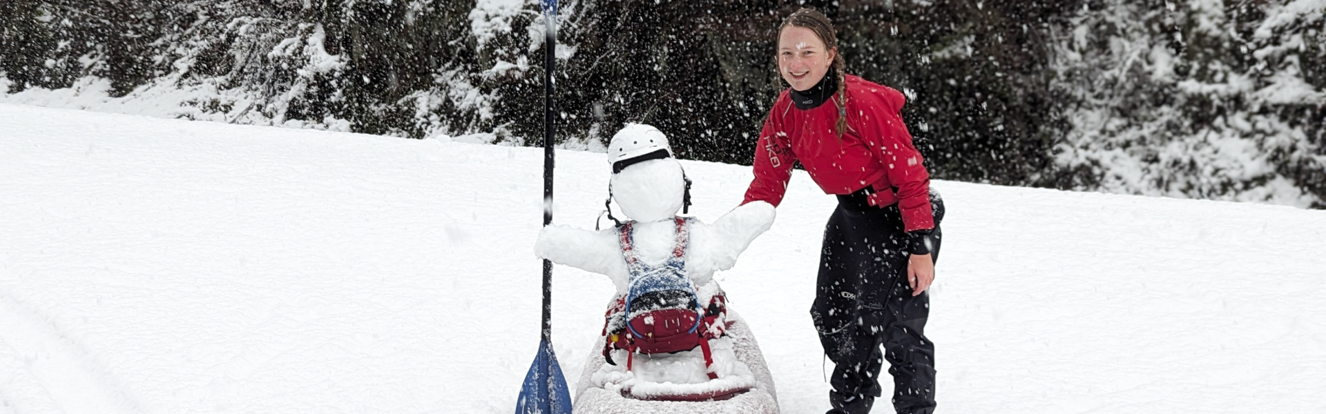 Waiting for the shuttle and building snowman in a kayak.